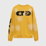 Back view of the vibrant Hellstar Sports yellow crewneck sweater featuring a black star and flame graphic print.