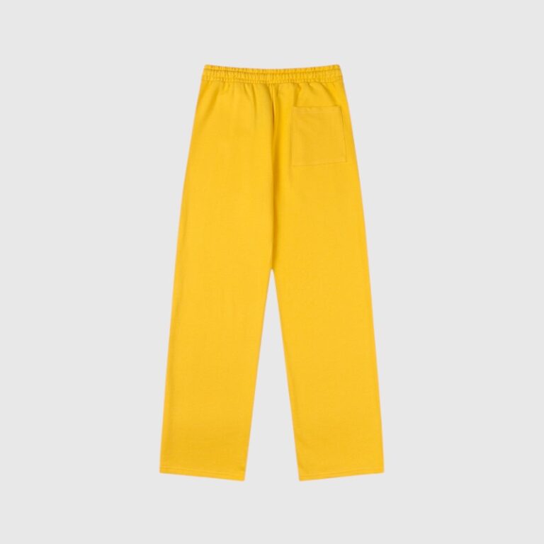 Back view of the Hellstar Sports yellow sweatpants, featuring a comfortable relaxed fit and premium fleece fabric.