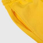 Close-up view of the premium heavyweight fleece fabric and functional side pocket on the Hellstar Sports Yellow Sweatpant.