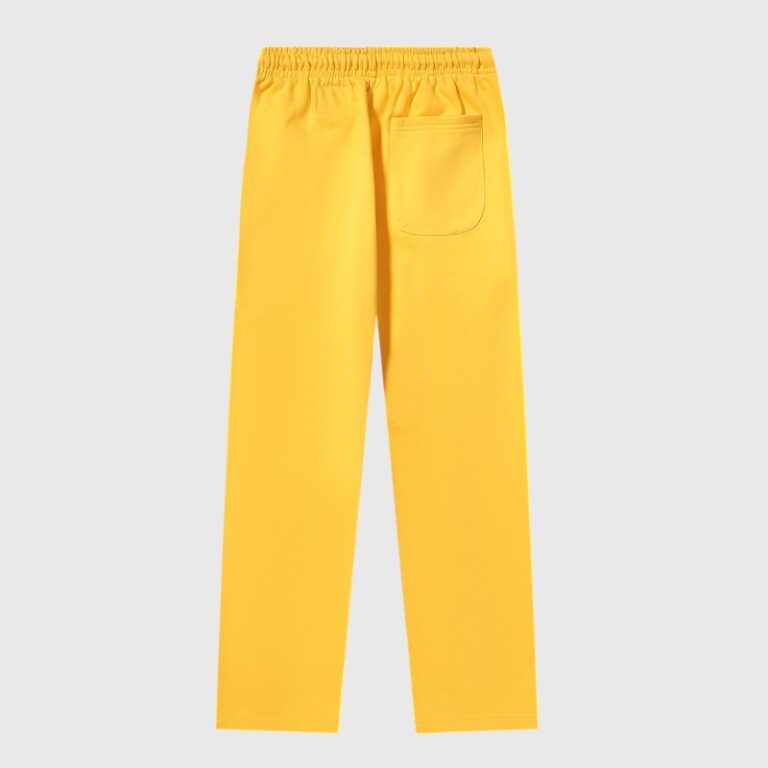 A detailed back view of the vibrant yellow Hellstar Sports sweatpants showing the elastic waistband and pocket detail.