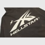 The back view of a jet-black Hellstar Sports zip-up hoodie featuring the iconic white brand logo screen print.