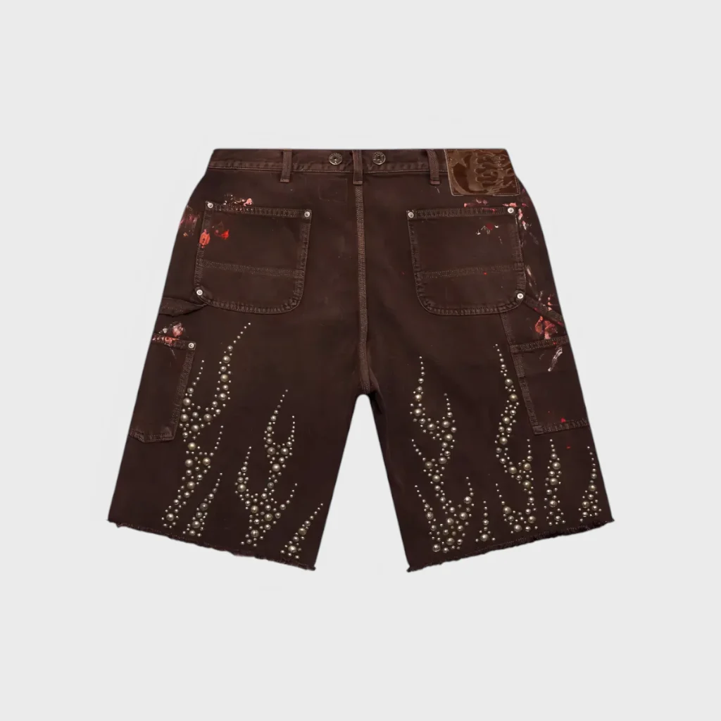 Hellstar Studded Denim Carpenter Shorts in Brown featuring metallic stud detailing and a rugged streetwear aesthetic.
