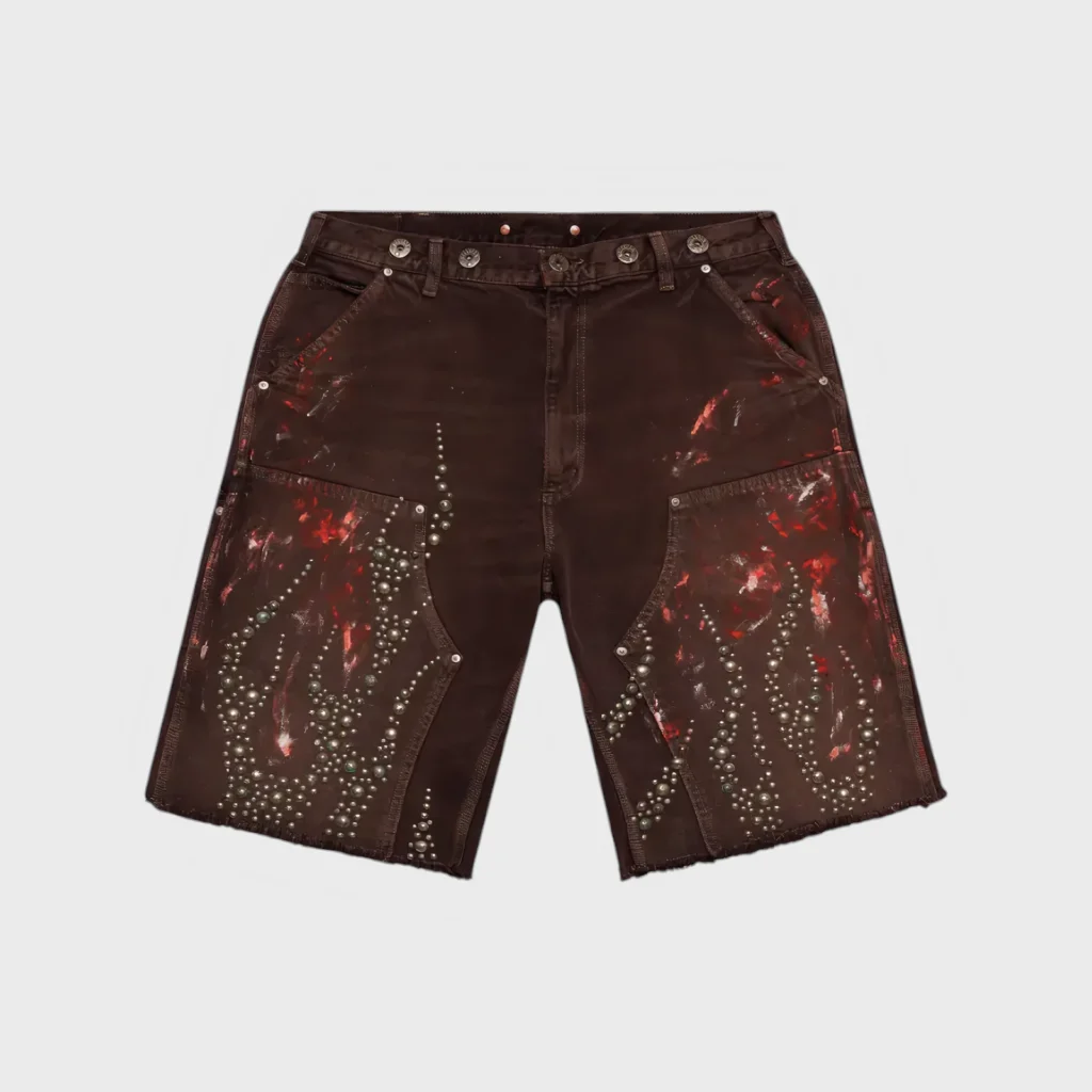 Hellstar Studded Brown Denim Shorts with distressed red paint splatter and premium metallic hardware detailing.