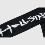 Black Hellstar Studios 08 graphic long sleeve shirt showcasing the branded white screen print detail on the sleeve.