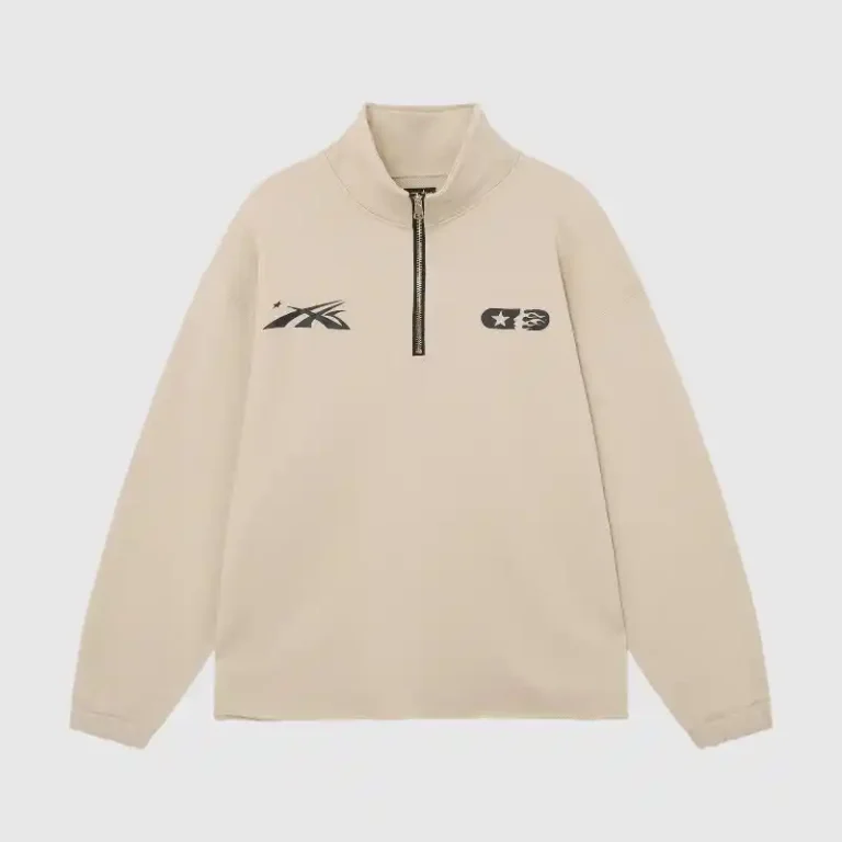 Beige Hellstar Studios quarter-zip sweater featuring graphic chest logo prints in a casual relaxed fit design