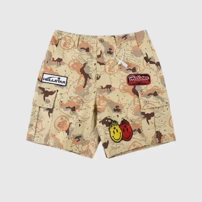 Hellstar Studios Bermuda War Shorts featuring a desert camo print, cargo pockets, and signature flame-head smiley patches.