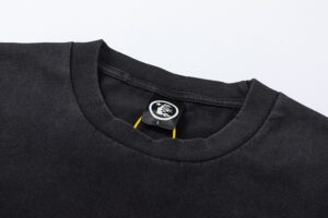 Close-up view of the interior neck tag on a black Hellstar Studios Biker Tour T-shirt featuring the logo.