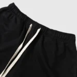 Hellstar Studios black fleece shorts featuring a comfortable elastic waistband and durable drawstring adjustment detail.
