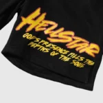Premium black fleece Hellstar Studios shorts featuring bold yellow custom screen-printed graphics and unique typography.