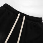 Close-up of the waistband and white drawstring on the Hellstar Studios Classic Black Shorts in a premium fleece fabric.