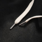 Close-up of the vintage washed black fabric and premium drawstring detailing on Hellstar Studios Classic Shorts.