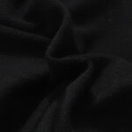 Close up view of the premium black cotton fabric used for Hellstar Studios classic black shorts apparel collection.