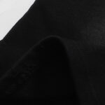 Close up shot showcasing the premium black fabric texture of the Hellstar Studios Classic Shorts apparel design.