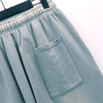Detailed view of the side pocket on the Hellstar Studios Flame Grey vintage washed fleece sweatpants.