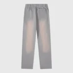 Hellstar Studios Flame Grey unisex tracksuit pants in a washed vintage grey cotton fabric, back view with pocket.