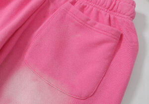 Close-up view of the premium heavyweight pink fleece pocket detail on Hellstar Studios Flame streetwear sweatpants.