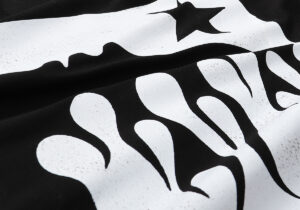 Close-up view of the bold white graphic screen print design on the black Hellstar Studios Future Hoodie fabric.