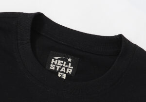 Close-up view of the branded interior neck label on a premium black Hellstar Studios Heaven on Earth cotton T-shirt.