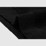 Close-up view of the ribbed fabric cuff detail on the Hellstar Studios Heaven On Earth black premium hoodie.