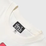 The official Hellstar Studios logo printed on the inner neck label of a Human Development tee.