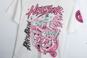 Hellstar Studios white t-shirt featuring the No Guts No Glory graphic print with pink anatomy art on the front.