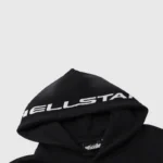 Close-up of the Hellstar Studios Path To Paradise black hoodie showing branding detail on the hood and interior label.