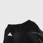 Hellstar Studios Path To Paradise black track pants featuring a triangle graphic and drawstring waist for streetwear.