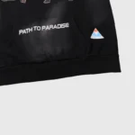 Detailed view of the Hellstar Studios Path To Paradise black hoodie with a printed graphic on the front pocket.