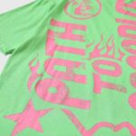 Hellstar Studios lime green t-shirt featuring Path to Paradise graphic print with pink flames and stars design.