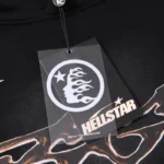 Hellstar Studios Path To Paradise black tracksuit clothing tag with signature brand logo and graphic design detail.