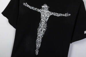 A black Hellstar Studios T-shirt featuring a striking white graphic of Christ rendered in a QR code design.