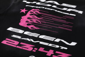 Detailed close-up view of the screen printed graphic on a Hellstar Studios QR Christ black t-shirt showing text.