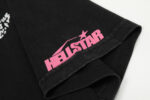 Close up view of the pink Hellstar logo printed on the sleeve of a black Hellstar Studios QR Christ T-Shirt.