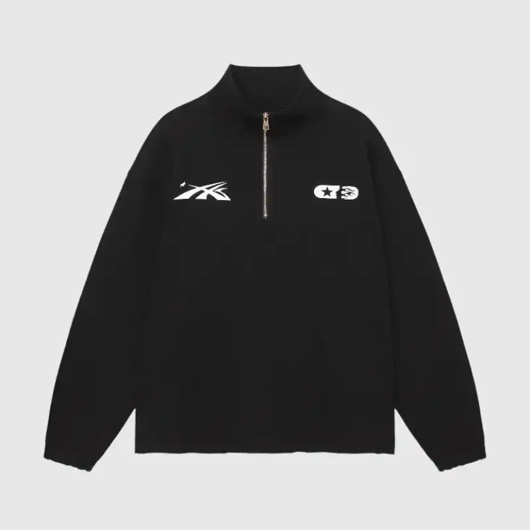 Black Hellstar Studios quarter zip sweater with white graphic prints and a high collar for a retro aesthetic