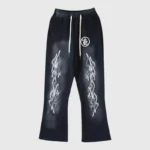 Hellstar Studios black vintage washed racer flare sweatpants with iconic white flame graphic print detailing.