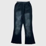 Back view of black Hellstar Studios Racer Flare Sweatpants featuring a vintage washed look and drawstring waistband