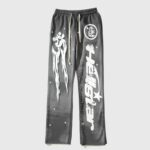 Hellstar Studios Racer Flare Sweatpants in jet black with white screen-printed motorsport graphics and a flared leg cut.