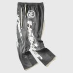 Hellstar Studios Racer Flare Sweatpants in Jet Black with high-density graphic screen prints and a flared leg silhouette.