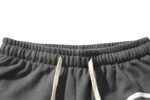 Close-up view of the elasticized adjustable waistband and drawstring closure on Hellstar Studios Racer Flare Sweatpants.