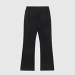 A back view of the black Hellstar Studios Racer sweatpants featuring a relaxed, flared leg design and drawstring waist.