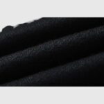 Close-up view of the premium black fleece fabric used for Hellstar Studios Racer Sweatpants design and construction.