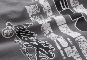 Close-up of the Hellstar Studios Rage T-shirt in dark grey featuring bold white and black distressed graphic details.