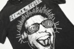 Hellstar Studios Rage T-shirt in washed black with a bold white graphic of a laughing person wearing headphones.