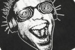 Close-up graphic detail of the black Hellstar Studios Rage T-shirt featuring a stylized screaming face with spiral eyes.