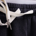 Close-up of the black Hellstar Studios Records shorts featuring a comfortable elastic waistband and custom drawstrings.