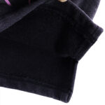 A close-up view of the black vintage-washed fabric of the Hellstar Studios Records Shorts, showing the high-quality textile.