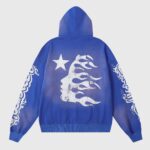 Blue Hellstar Studios Records Yoga Hoodie featuring a white distressed graphic print of a star and face on the back.