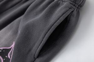 Close-up view of the premium fleece fabric and side pocket detailing on Hellstar Studios Records Jet Black Shorts.
