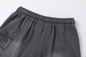Close-up view of the elastic waistband on the Hellstar Studios Records jet black shorts with branded graphic detail.