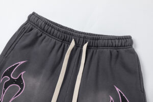 Close up of the elastic waistband and drawstring on Hellstar Studios Records Jet Black graphic shorts.